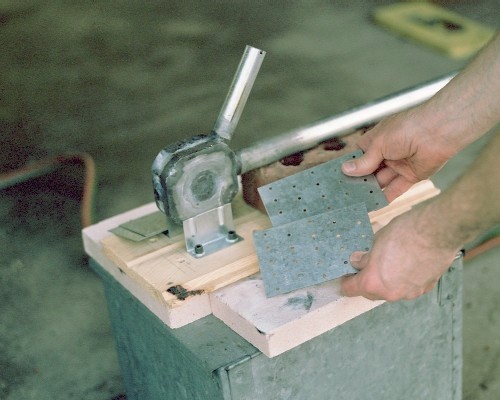 Jigging the engine and mounts into proper alignment before tack welding (c) 2004 Larry Cottrill