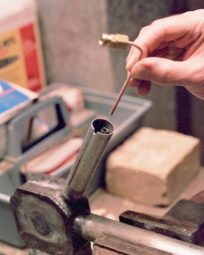 Finished fuel delivery tube shown being dropped into place in the intake tube (c) 2004 Larry Cottrill