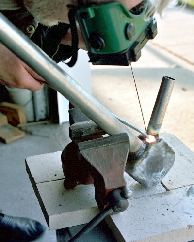 Finish welding the intake stack to the chamber (c) 2004 Larry Cottrill