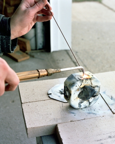 Welding up the smaller knockouts (c) 2004 Larry Cottrill