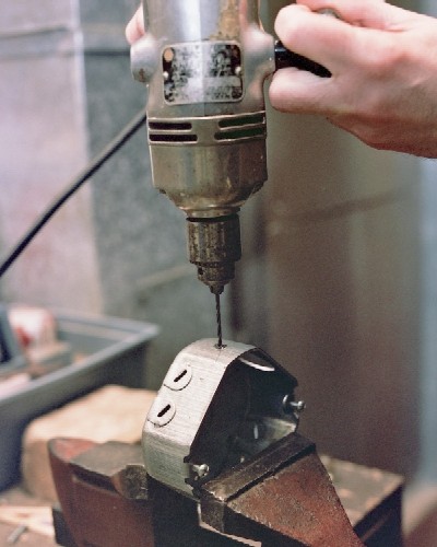 Starting the air intake port with small hand drill (c) 2004 Larry Cottrill