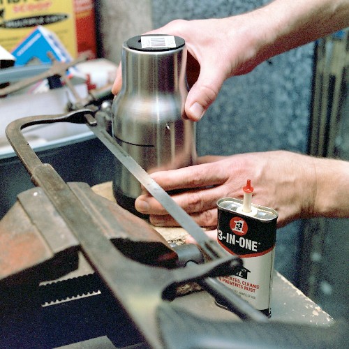 Cutting the groove around the mug shell, to cut excess length from the diffuser section (c) 2003 Larry Cottrill