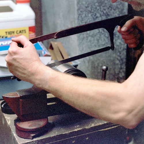 Cutting the diffuser section to final length with the hacksaw (c) 2003 Larry Cottrill