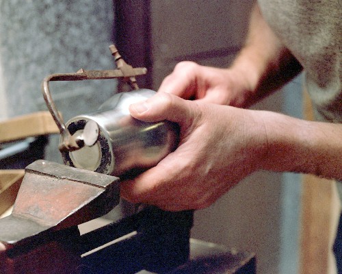 Cutting out the end of the diffuser section, using the jeweler's saw (c) 2003 Larry Cottrill