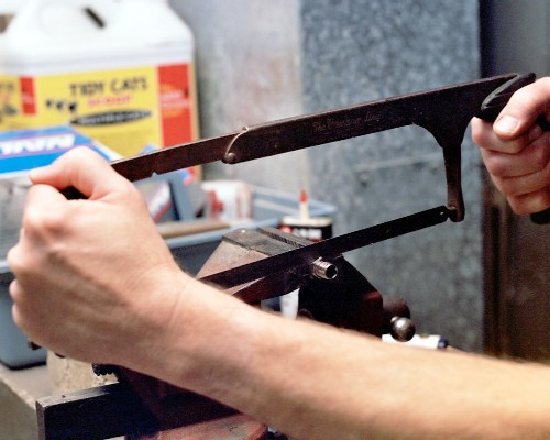 Cutting the pipe-threaded end off the fuel pipe mount fitting (c) 2003 Larry Cottrill