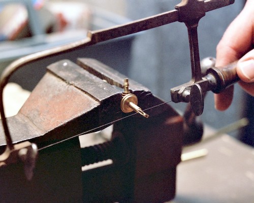 Cutting off the short machined end of the needle valve body (c) 2003 Larry Cottrill